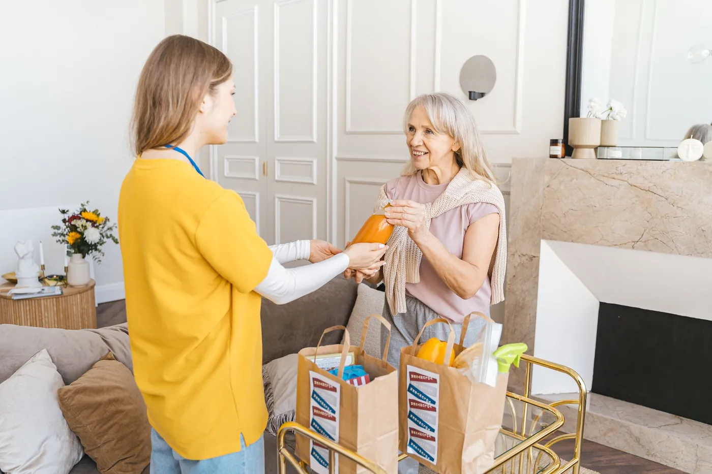 A support worker helping a participant at home.